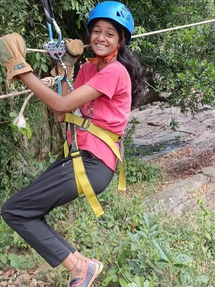 A happy and confident camper on the zipline at our Barapole camp.