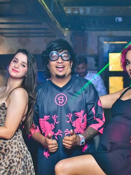 The party in full swing with laser lights in the background. My goal is to create an immersive experience where everyone can have fun.