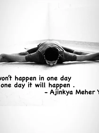 A black and white shot of my practice in Upavistha Konasana. The quote says it all: "It won't happen in one day, but one day it will happen." This is my belief for all of us.