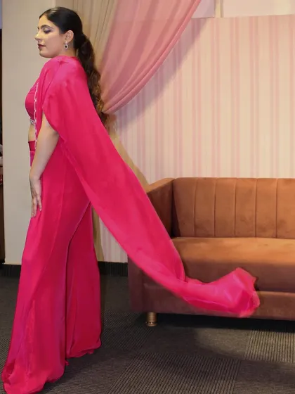 The cape on our pink co-ord set has a long, flowing train for added drama.