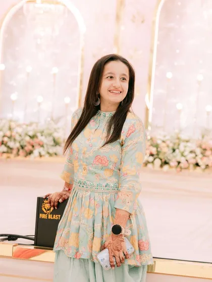 A happy moment at a friend's engagement, who was also my client! I'm dressed in a lovely pastel dhoti-kurta set, perfect for a day function.