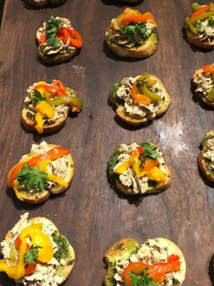 This is my version of a chicken and pesto bruschetta, topped with colourful bell peppers. I use fresh, high-quality ingredients to ensure every bite is packed with flavour for your event catering needs.