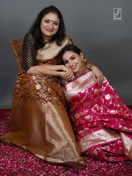 An intimate and joyful moment captured between two models, perfect for storytelling in a heritage brand campaign.