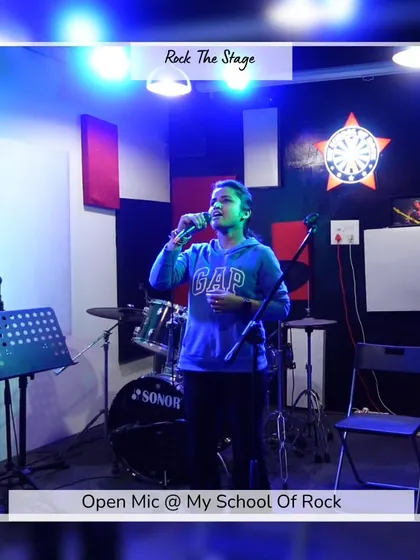 This is the goal: getting up on stage and sharing your voice. This young performer is owning the spotlight during one of our Open Mic nights. My programs are designed to build this kind of music confidence in children and adults alike.