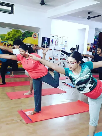 A group practicing Natarajasana (Lord of the Dance Pose). This beautiful balancing pose improves focus, opens the shoulders, and stretches the entire front of the body.
