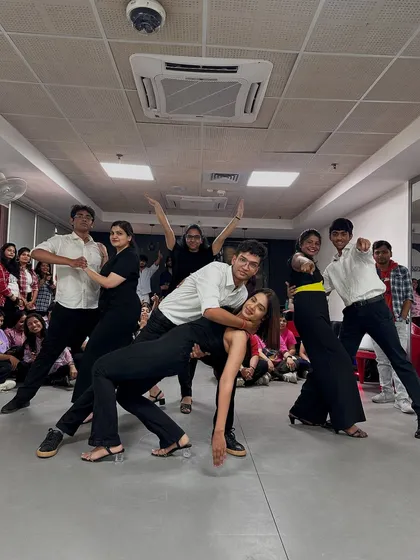 The Bollywood Salsa group striking a final pose. This picture captures the fun and flair of their partner dance routine.