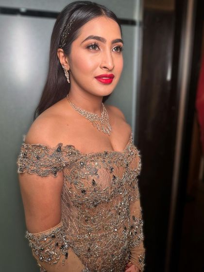 Another angle of this glamorous cocktail style. The makeup is designed to be striking and sophisticated, perfect for a memorable evening.