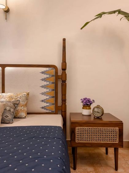 The Maadhya bed paired with the Bagh side table at our studio. The bed's headboard features a unique block-printed fabric, showcasing how we use textiles to personalize our furniture.