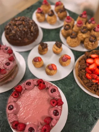 A beautiful spread of my most loved Mother's Day desserts, including raspberry cakes, a strawberry tart, and assorted choux pastries.