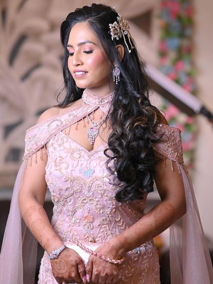 My client Vijita from Kochi sent me these beautiful pictures from her engagement. She looks like a doll in her pink mermaid gown, with makeup that is both soft and glamorous.