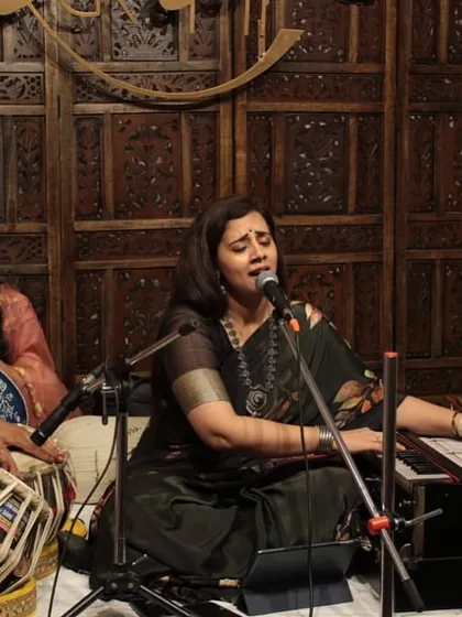 The complete ensemble during a baithak, with vocal, tabla, harmonium, and tanpura. We ensure a full, authentic soundscape for every performance, whether it's in a large hall or an intimate room.