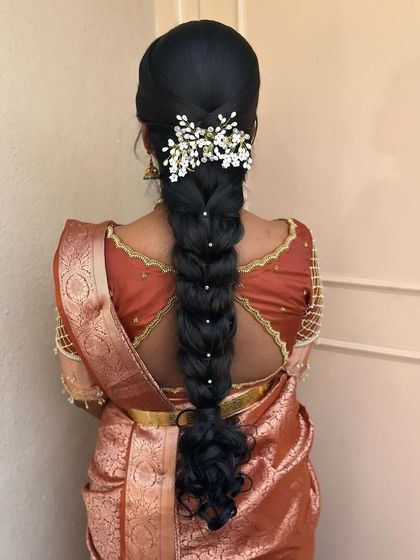 This messy braid is perfect for a pre-wedding ritual. I wove in delicate baby's breath and pearl accessories to create a soft and romantic look.