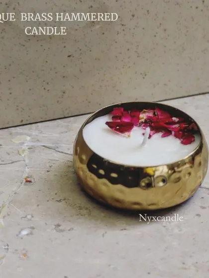 A beautifully styled shot of our antique brass hammered candle, topped with dried rose petals. This single-wick urli candle is perfect for creating a serene and festive ambiance.