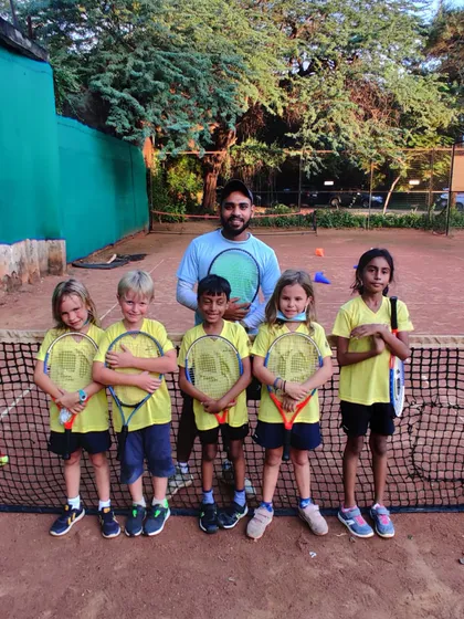 My mini tennis group posing with their coach. The goal of the Junior Kickstart program is to create a positive and encouraging first experience with tennis.