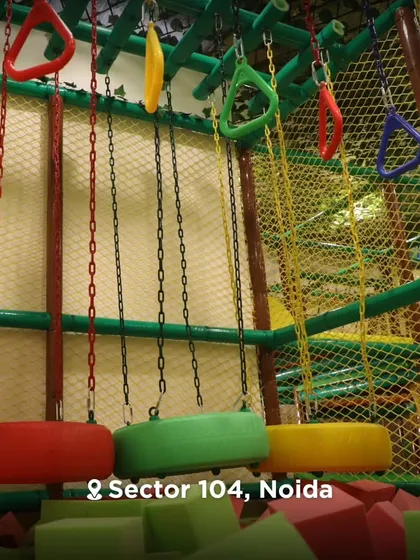 A view of the ninja course with its colorful tire swings and hanging rings, ready for the next challenger.