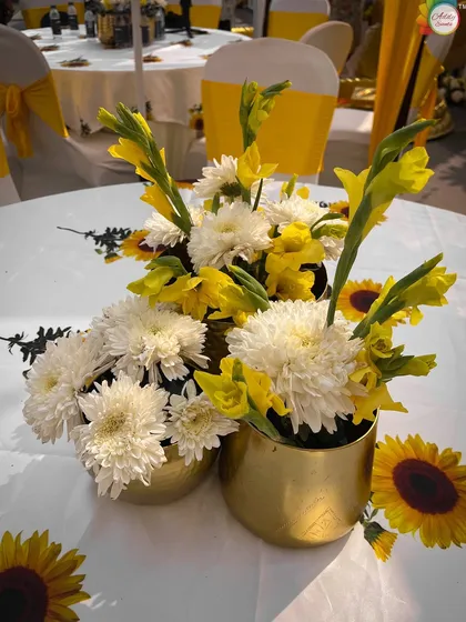 Another view of the cheerful Haldi centerpieces, perfect for brightening up the guest tables.