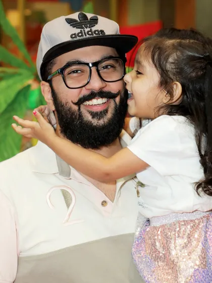 A heartwarming moment between a father and daughter at the Cinderella party, showing that these celebrations are about creating precious family memories.
