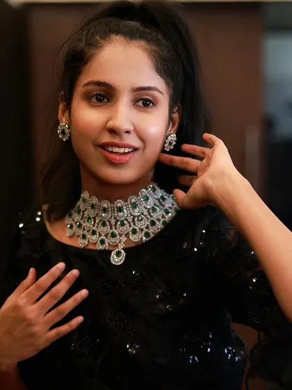 This is a close-up of one of my popular American Diamond and green stone choker sets. It's a versatile piece that you can rent for receptions, sangeets, or even cocktail parties to add a touch of modern glamour.
