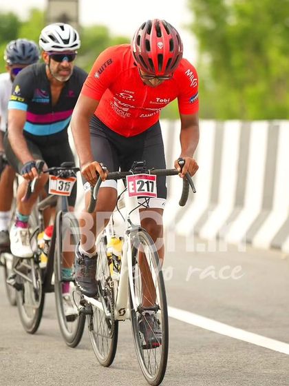 A group of elite riders, including one from the Velo racing team, in a breakaway.