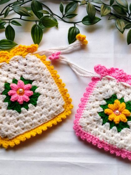The traditional granny square stitch gives these pouches a lovely, soft texture. They are perfect for keeping small, precious items safe, whether it's your jewellery, keys, or small idols.