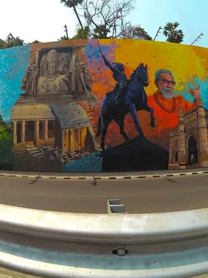 A panoramic mural that serves as a collage of Mumbai's history and culture. It features landmarks like the Gateway of India alongside portraits of historical figures like Shivaji Maharaj and Balasaheb Thackeray.