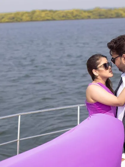 A romantic moment between the couple on a yacht, with the Goan coastline in the background.