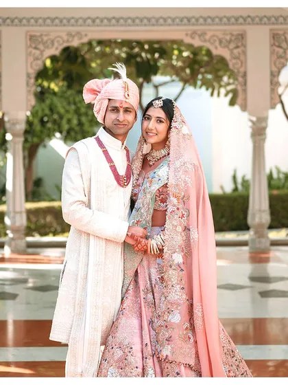 A happy couple posing for a classic portrait. The smiles and relaxed posture are a testament to a stress-free wedding day, which is always my ultimate goal.