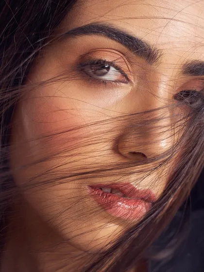 A slightly more direct gaze from the same series. The makeup is minimal, with a focus on a healthy flush of blush and a natural-looking lip color.