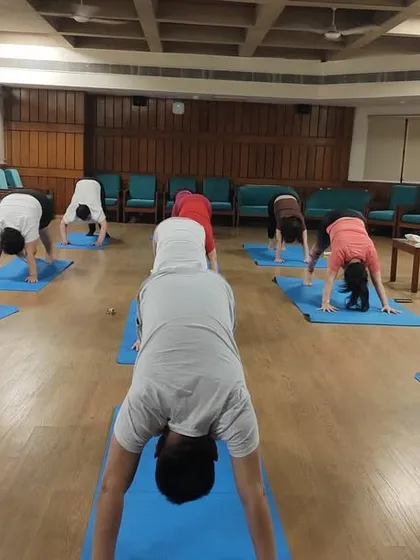 Here is a glimpse of an in-person teacher training session at my Noida center with students from around the world. We focus on correct alignment and form, such as in Adho Mukha Svanasana (Downward-Facing Dog), in a supportive group environment.