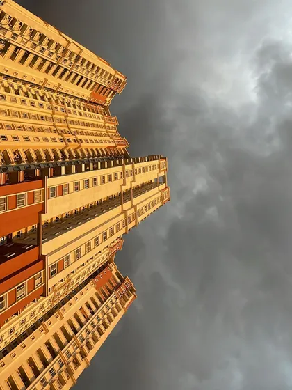 A dramatic look up at one of Bangalore's impressive residential towers. I provide solid advice on high rise apartment investments that offer both a great lifestyle and value.