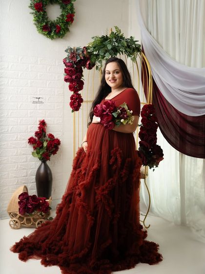 A full-length shot showcasing the dramatic and beautiful ruffled red gown. This is one of the many glamorous options available in my studio wardrobe.