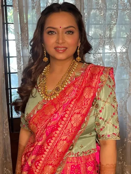 Hair and makeup for this absolutely stunning woman. The makeup is soft and luminous, highlighting her sparkling natural eye color.