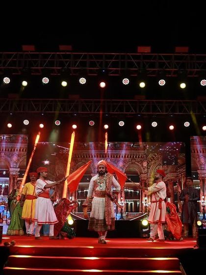 The LED backdrops I provide can display any custom content, like the historical visuals used for this performance at the 'Aai Gavdevi' song release. This adds a powerful storytelling element to the live show.