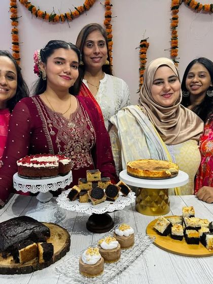A festive Diwali dessert table created by my talented masterclass students. They baked and arranged an entire spread of treats, including brownies, red velvet cake, and cupcakes.