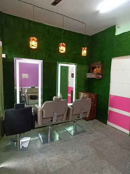 Artificial grass isn't just for outdoors. For this salon, I installed a full green wall to create a unique and calming atmosphere for their clients, showing the versatility of synthetic turf for commercial interiors.