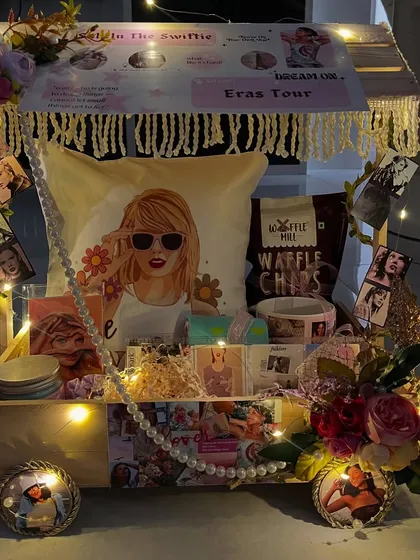 For the Swiftie in your life, this is the ultimate 'Eras Tour' in a box. I packed this custom cart with a personalized pillow, themed snacks, and tons of merch, creating a birthday gift that’s straight out of their wildest dreams.