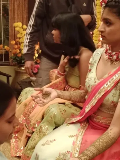 A candid moment during the mehendi shoot for a film.