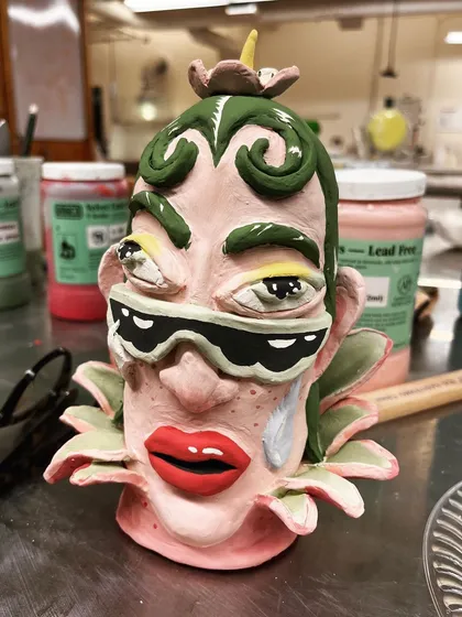 One of the flower heads after glazing, showing the vibrant, unpredictable results of the firing process.