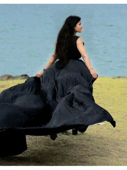 A powerful and elegant shot of our black pre-wedding gown. The long trail creates a beautiful silhouette against the natural backdrop.