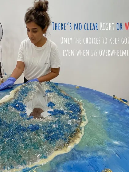 An image of me working on a large, ocean-inspired geode table. There's no clear right or wrong in art, only the choice to keep going even when it's overwhelming.