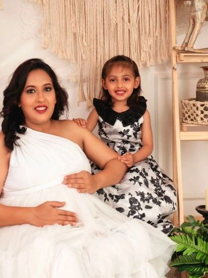 A sweet moment between a mother and her daughter, both excited to welcome the new baby.