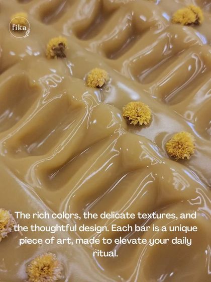 The rich colors, the delicate textures, and the thoughtful design. This close-up of a freshly textured soap loaf topped with flowers shows how each bar is a unique piece of art, made to elevate your daily ritual.