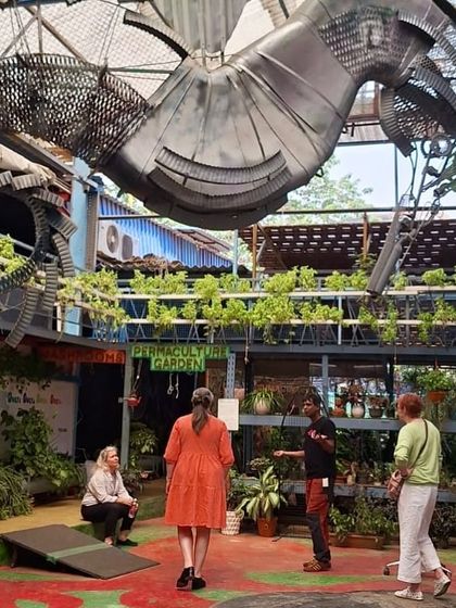 A tour of our permaculture garden and unique recycled art installations. This photo was taken during a visit from Aalto University for the premiere of their "Radical Creatives" film.