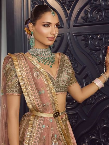 The side profile of this modern bridal look shows the seamless blend of makeup and the clean, elegant hairstyle. It's all about creating a cohesive and polished look.