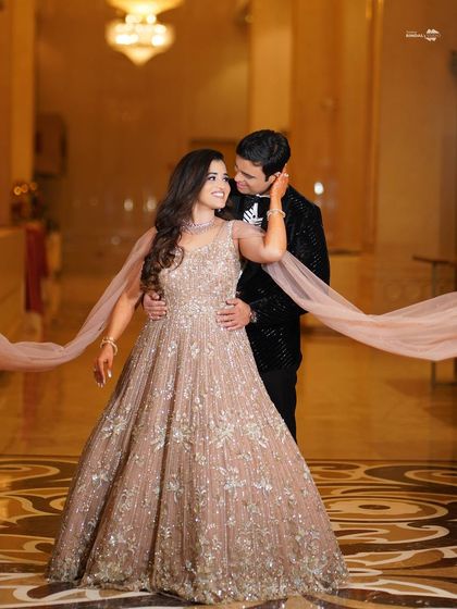 A dreamy, romantic portrait of the couple. The bride's flowing gown and their loving embrace create a beautiful sense of movement and connection.