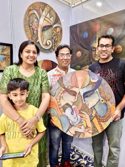 A happy family who purchased my large, circular Radha-Krishna painting at the Kalaspandan Art Fair in Pune.