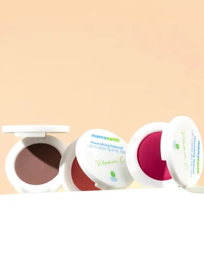 A clean, minimalist arrangement of lip tints. The composition is simple and elegant, allowing the products and their beautiful packaging to be the heroes of the shot.