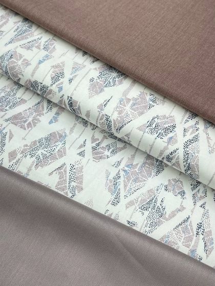 This fabric with a geometric, abstract print can be paired with different solid-colored izaars, like the brown and mauve options shown here.