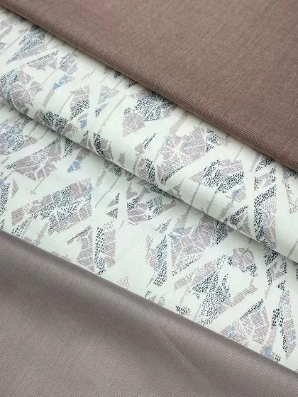 This fabric with a geometric, abstract print can be paired with different solid-colored izaars, like the brown and mauve options shown here.