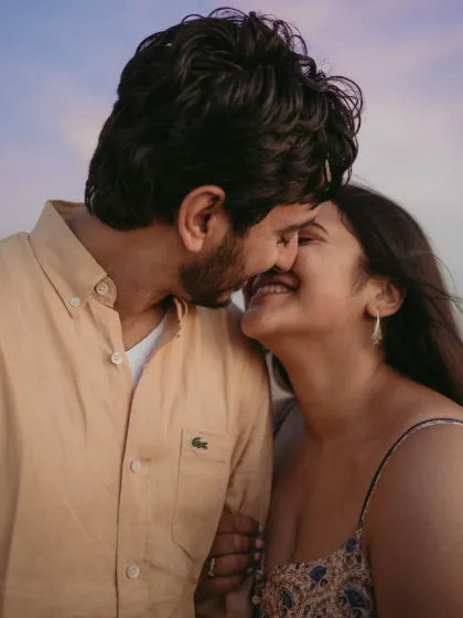 A sweet and intimate close-up of an almost-kiss. This shot is full of anticipation and affection, capturing the deep connection between the couple.
